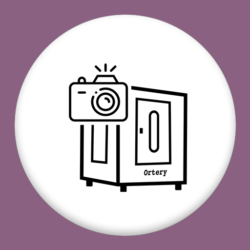 Ortery box with door and a camera icon on top left corner in a white circle with a light purple background.